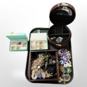 Four modern jewellery boxes containing assorted gold-plated jewellery, costume pieces,