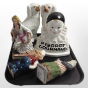 A pair of Staffordshire dogs, together with four further continental ceramic figures.