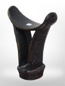 An African carved wood headrest, height 18cm.