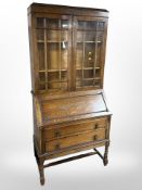 An Edwardian oak bureau bookcase, 92cm wide x 44cm deep x 194cm high.