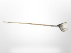 A 19th-century long-handled coal shovel with oak shaft, length 192cm.