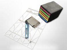 A wire metal rack, together with a Vanguard stapler, a guillotine, and an office filing chest.