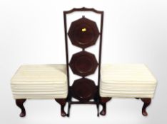 A mahogany three-tier cake stand and a pair of stools