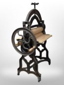 A 19th-century Danish painted cast-iron and pine mangle by Daniel Moller, width 88cm.