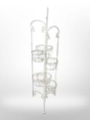 A painted wrought-metal plant pot stand, height 115cm.