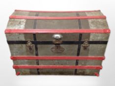 An early-20th century metal-bound dome-topped trunk, 80cm wide x 50cm deep x 55cm high.