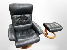 An Ekornes stressless black leather adjustable swivel chair with matching stool, width 76cm.