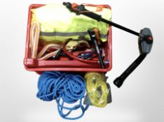 A group of two ropes, torch, high visibility jacket, brush, roadside hazard sign, etc.