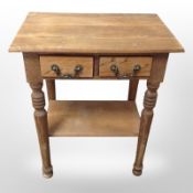 A continental blond oak side table,