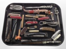 A collection of antique cutthroat razors, pocket knives, Swiss Army knives, letter openers, etc.