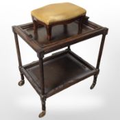 An early-20th century oak two-tier serving trolley, width 62cm, together with a small footstool.