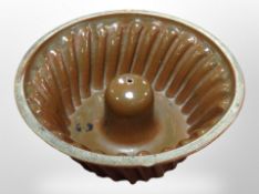 A 19th-century glazed earthenware jelly mould, diameter 27cm.