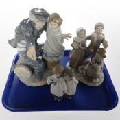 A Lladró and two Nao figure groups, all as found, tallest 32cm.