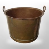 A large 19th-century copper twin-handled pot, diameter 52cm.