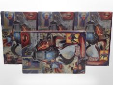 Four Mattel Superman figurines, boxed.