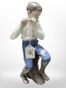 A Bing & Grøndahl figure of a boy playing the flute, height 29cm.
