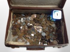 A vintage suitcase containing a large quantity of British pre-decimal coins,