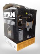 A Titan wet and dry vacuum in box.