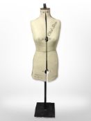 A vintage adjustable dress maker's dummy on metal stand,