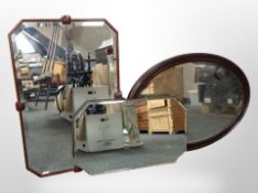 An Art Deco frameless mirror, together with two other mirrors, largest 85cm wide.