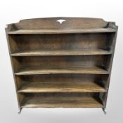 An Arts and Crafts oak open bookcase,