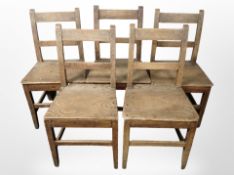 Five late-Victorian oak chairs.