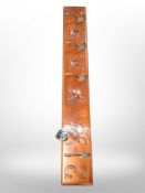 A reproduction carved coat rack,