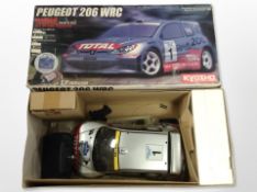 A Kyosho radio-controlled Peugeot 206 WRC car, in box.