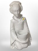 A contemporary Japanese white ceramic figure of a seated lady, height 62cm.
