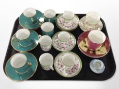A group of porcelain teacups and coffee cans with matching saucers including Paragon, Aynsley,