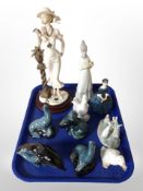 A group of Poole figures of sea lions, a dolphin and an otter,
