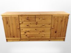 A contemporary pine sideboard,