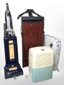 A Corby 4400 trouser press, together with a Delonghi heater, a further heater,