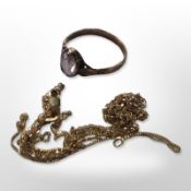 A 9ct gold ring set with a pale amethyst and two trace link chains.