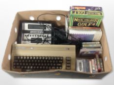 A Commodore 64 keyboard, a further Hanimex console, various cassettes and PC games, related manuals.