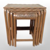 An Eastern carved hardwood nest of four tables,