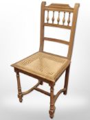 A beech bergère chair.