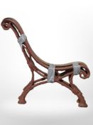 A pair of cast-iron bench ends.