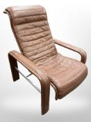 A contemporary Danish brown leather and chrome armchair, width 77cm.