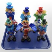 Six Murano glass clowns.