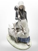 A Royal Copenhagen figure group of a lady and two goats, height 23cm.
