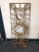 A wrought-metal panel, 84cm x 33cm.