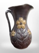 A large earthern ware floral decorated vase,