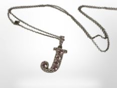 A silver encrusted letter J pendant on 35-inch silver chain.