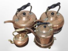 Four copper kettles.