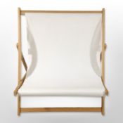 An oversized folding deck chair, width 106cm.