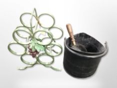 A wrought-metal bottle rack, height 37cm, together with a coal bucket and shovel.