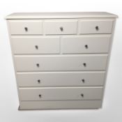 A contemporary single door cabinet with dummy drawers,