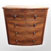 A Victorian mahogany bow-front five drawer chest,