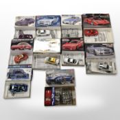 Nine Tamiya scale car modelling kits, and another Cobra kit.